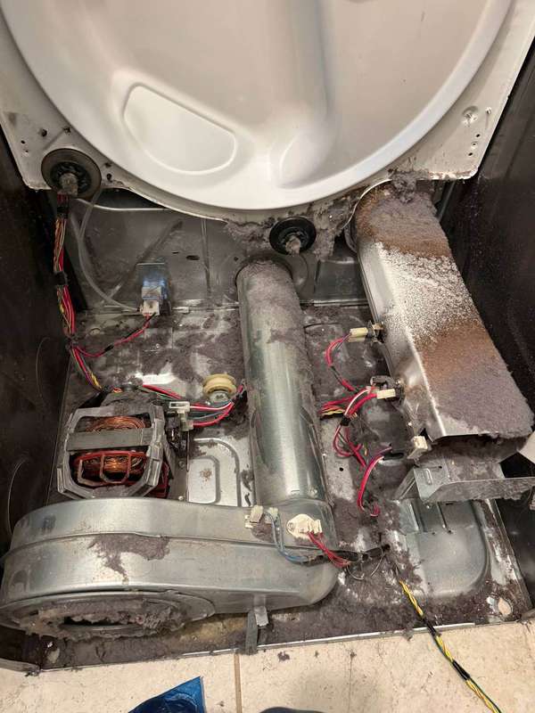 Dryer disassembled showing motor blower and heating components - Done Right Appliance Repair