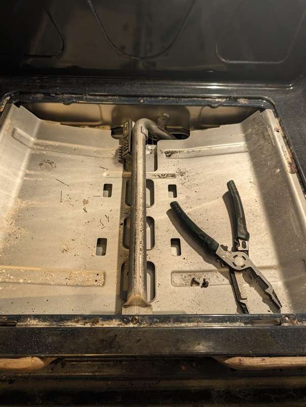 Gas oven bake burner exposed for igniter replacement, Fort Worth TX