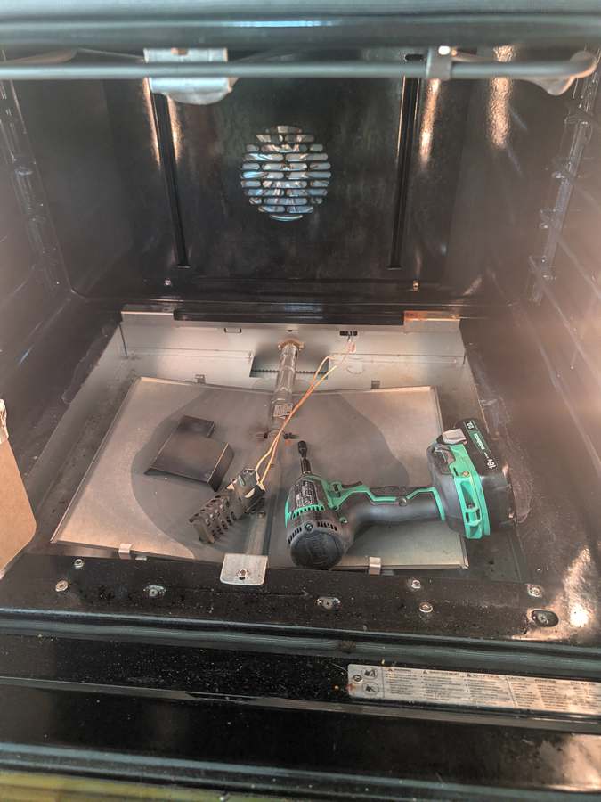 GE gas oven floor panel removed for igniter replacement - Fort Worth TX
