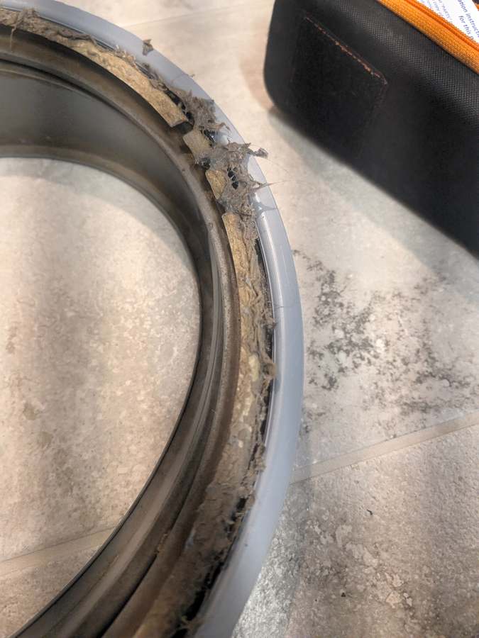 Washer door boot removed showing trapped lint and debris — Fort Worth TX